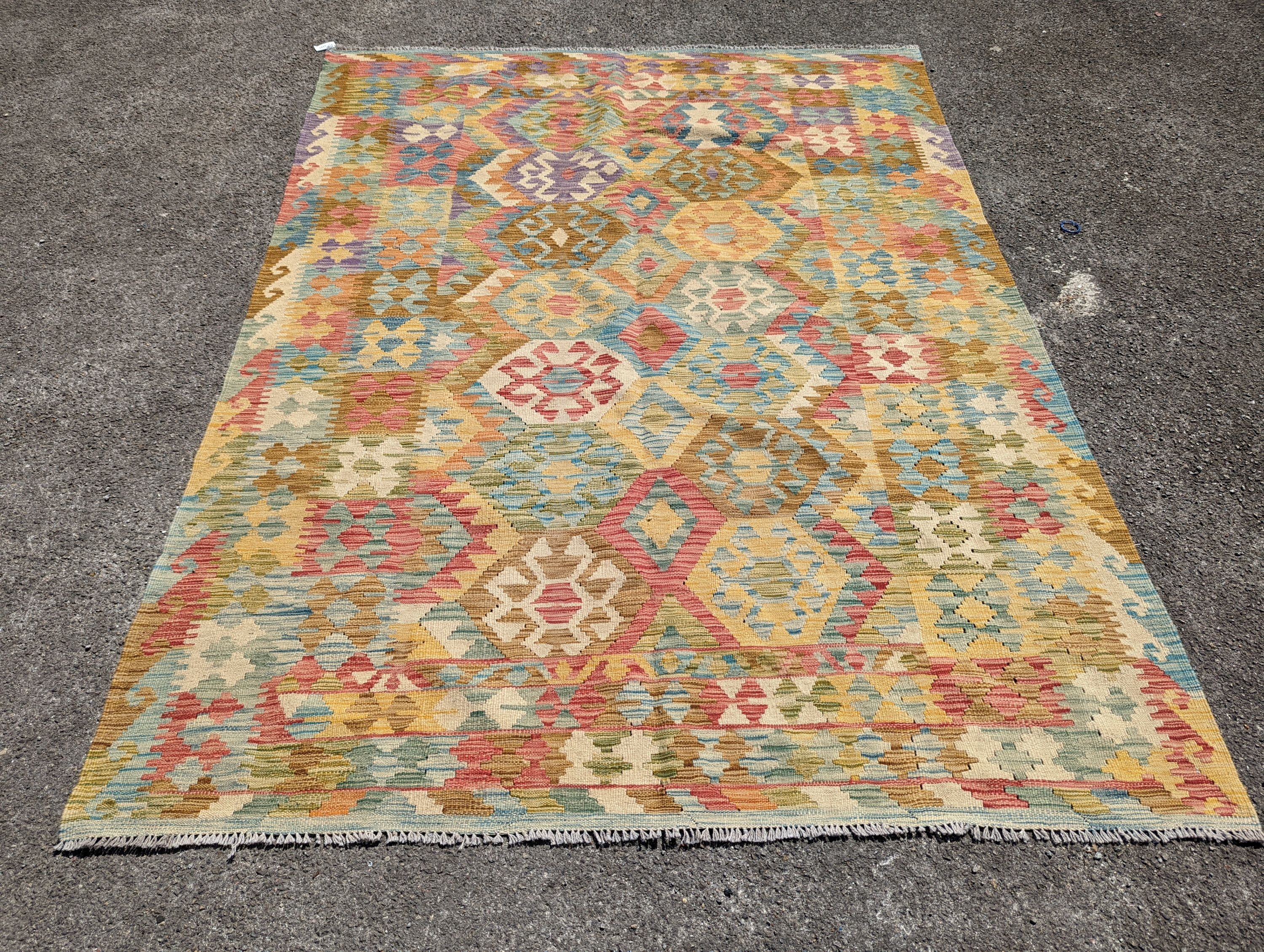 An Anatolian design polychrome geometric flatweave Kilim carpet 270 x 200cm